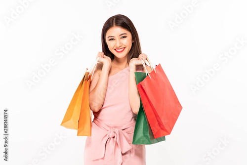 Shopping woman happy smiling holding shopping bags isolated on white background