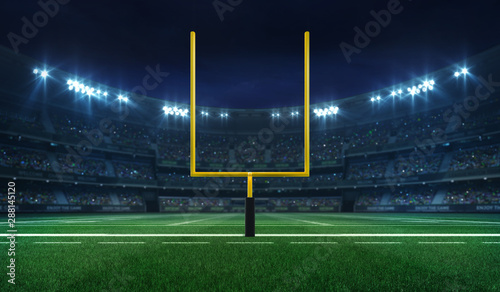 Fotografia American football league stadium with yellow goalpost front and fans, illuminate