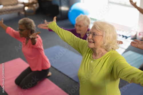 Senior people exercising in fitness studio