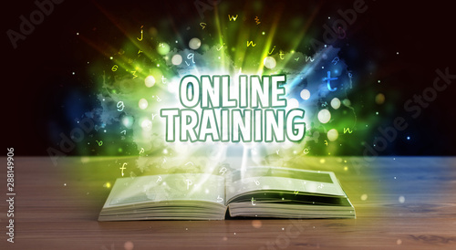 ONLINE TRAINING inscription coming out from an open book, educational concept