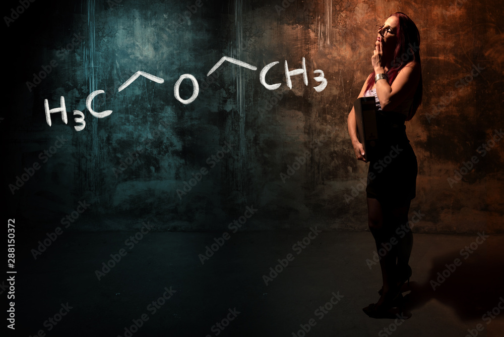 Sexy girl or secretary or female student presenting handdrawn chemical formula of Diethylether Sexy girl or secretary or female student presenting handdrawn chemical formula of Diethylether