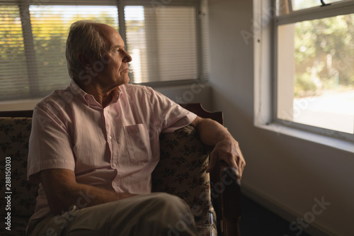 Senior man relaxing in living room at home