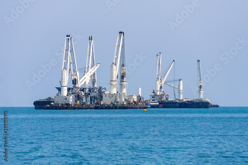 Koh Si Chang, THAILAND - MAY 20, 2019 : Large cargo ship Parked in the sea During the trip to Koh Si Chang