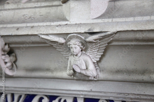 marble plaster religious angel cherub with wings in decaying white 