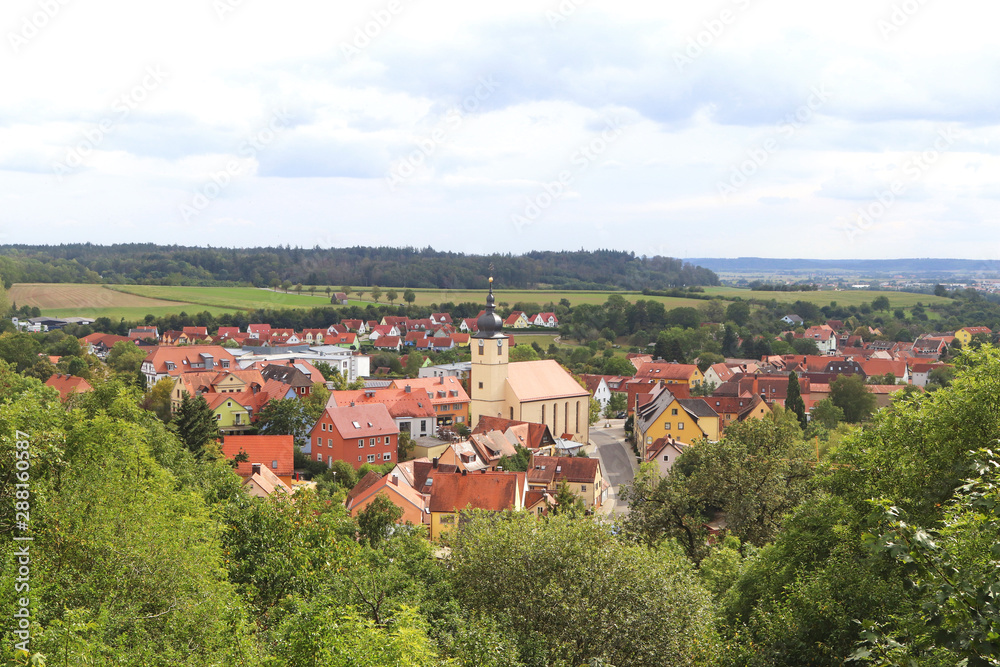 panoramic view with a Bavarian village in green surrounding
