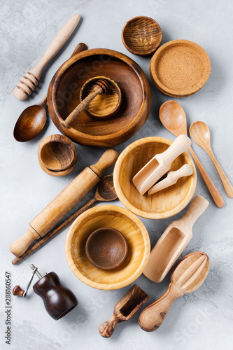 Wooden empty dishes for cooking on gray concrete background. Zero waste concept. Flat lay.