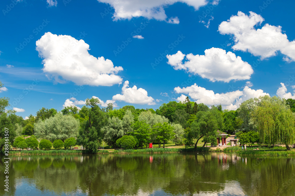 Cumulonimbus clouds over lake, city lake in Minsk