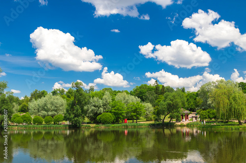 Cumulonimbus clouds over lake, city lake in Minsk