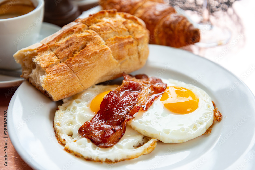Breakfast with coffee and croissants on table Breakfast with coffee and croissants on table
