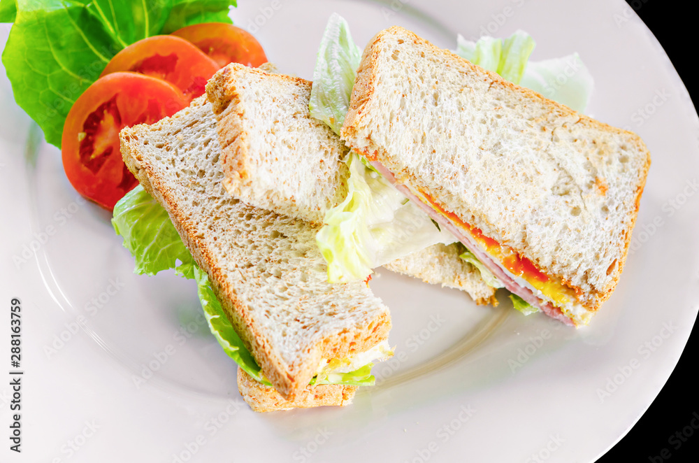 Sandwich with ham tomato and egg with vegetable. Sandwich with ham tomato and egg with vegetable.