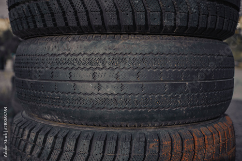 car rubber tires lying on top of each other.