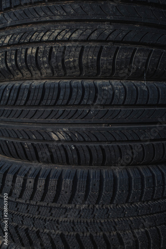 car rubber tires lying on top of each other.