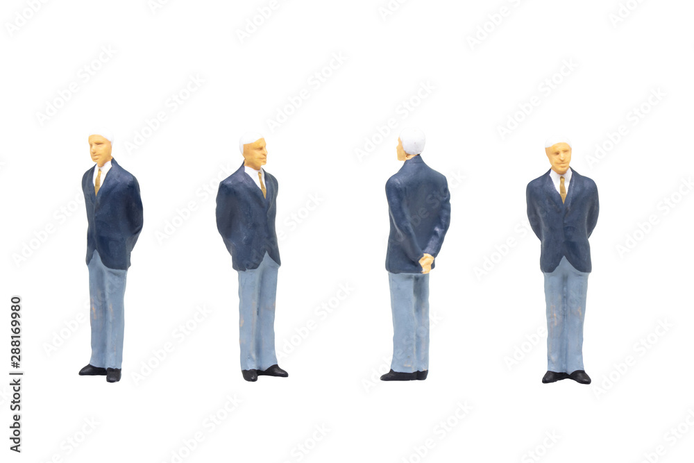 Miniature figurine character as businessman standing and working in posture isolated on white background. Miniature figurine character as businessman standing and working in posture isolated on white background.