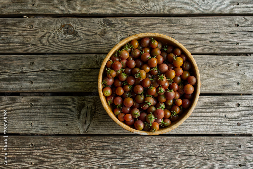 red miniature tomatoes in a bowl