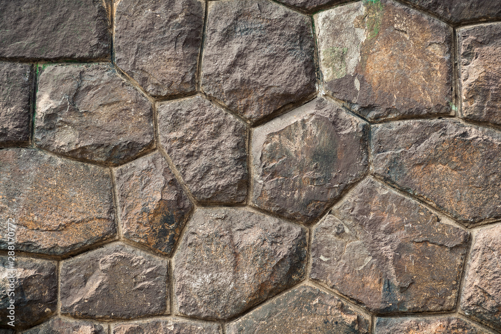 art background of large brown stone boulders in an ancient wall with high-precision masonry face to face for the original historical project or artistic design or decoration art background of large brown stone boulders in an ancient wall with high-precision masonry face to face for the original historical project or artistic design or decoration