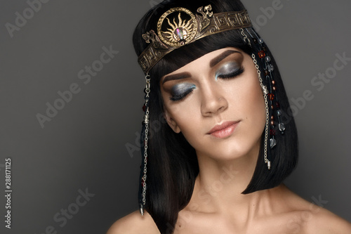 Fashion Stylish Beauty Portrait with Black Short Hair. Beautiful Girl's Face Close-up. Hairstyle. Fringe. Professional Makeup. Make-up. Cleopatra