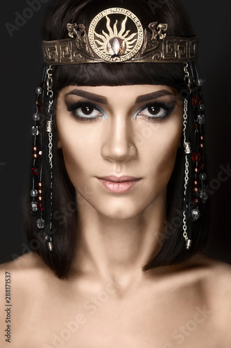 Fashion Stylish Beauty Portrait with Black Short Hair. Beautiful Girl's Face Close-up. Haircut. Hairstyle. Fringe. Professional Makeup. Make-up. Cleopatra
