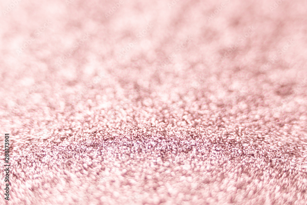 Pink glitter texture Festive sparkling sequins background closeup. Wpaper for Valentine, New Year or Christmas Holidays.