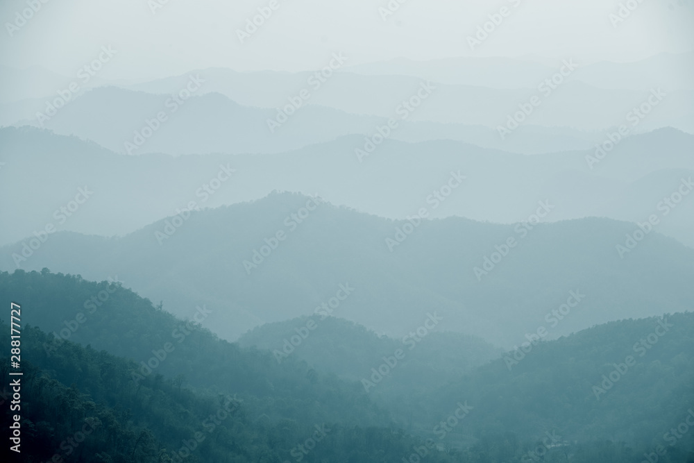 Naklejka premium Foggy Hills Background Samoeng Forest near Chiang Mai