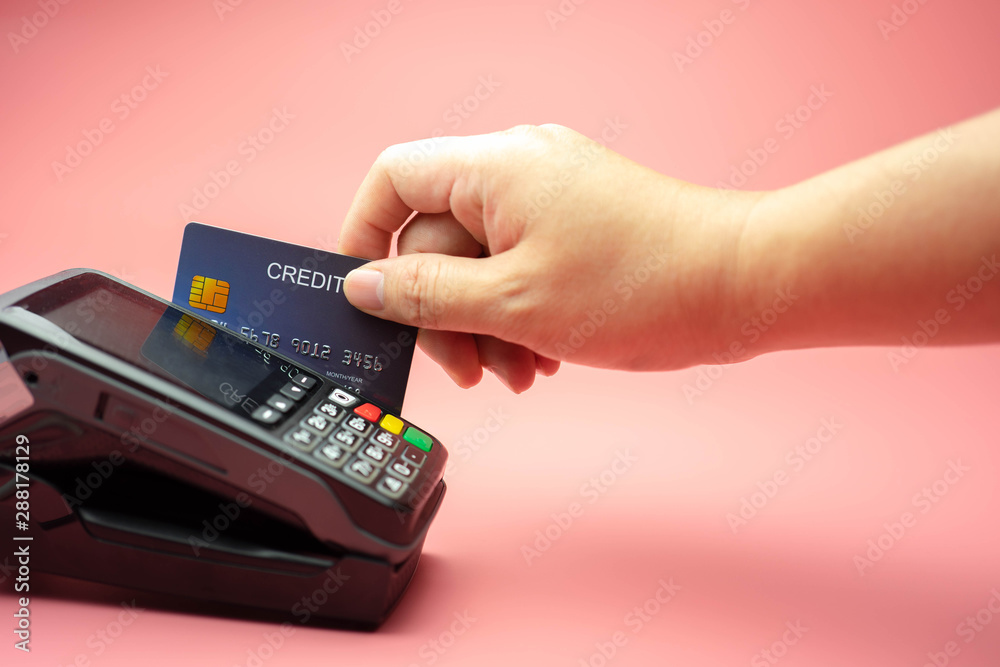 Hands swiping Credit card on Credit card machine or Credit card Terminal, Finance concept. Hands swiping Credit card on Credit card machine or Credit card Terminal, Finance concept.