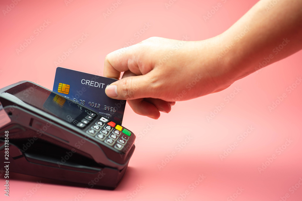 Man Hands swiping Credit card on Credit card machine or Credit card Terminal, Finance concept. Man Hands swiping Credit card on Credit card machine or Credit card Terminal, Finance concept.