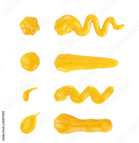 Set of drips of Mustard sauces of different shapes on a white background
