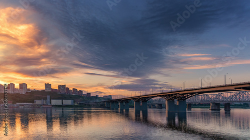 Bridge over the Yenisei river, evening sunset. Krasnoyarsk, Russia. panorama of the evening city © Vladimir Razgulyaev