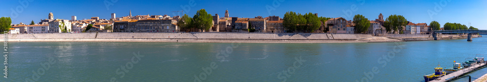 Arles. Panoramic view of the city promenade and the city at sunset.