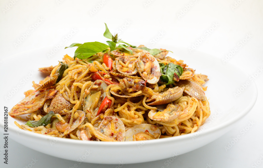 Stir fried noodles with clams and herbs, hot and spicy dish Stir fried noodles with clams and herbs, hot and spicy dish