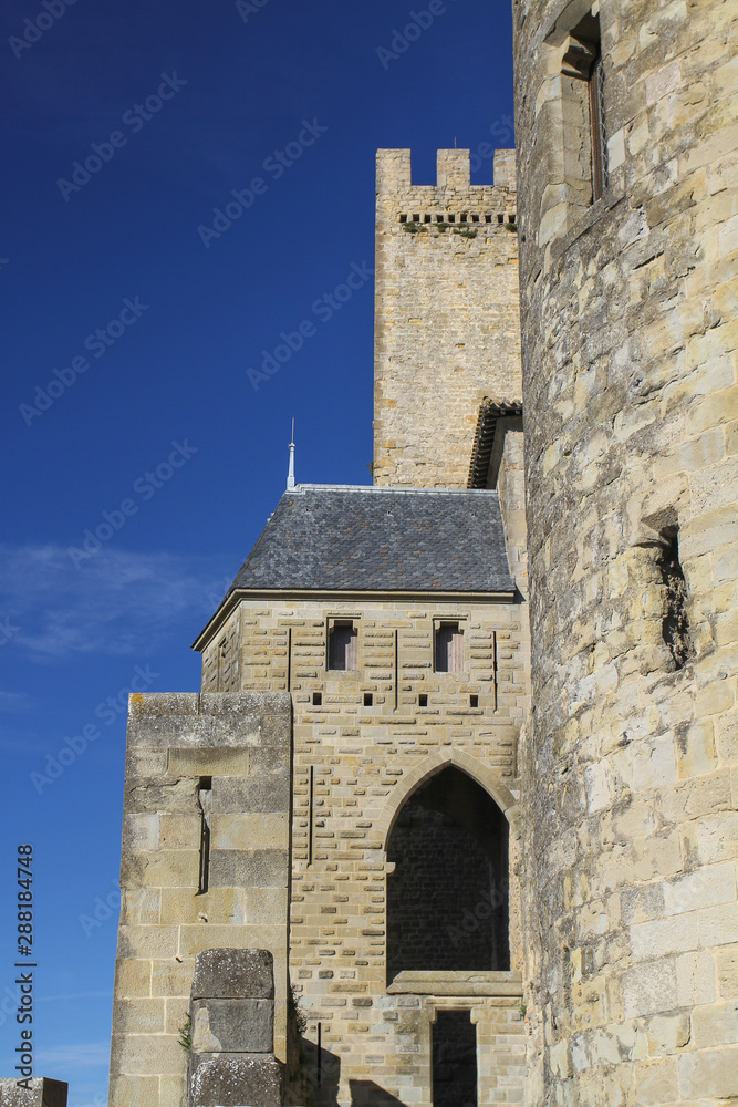 Medieval stone architecture with round tower, Carcassonne, France, Europe. Buildings dating from 13th and 14th centuries. Unesco world heritage