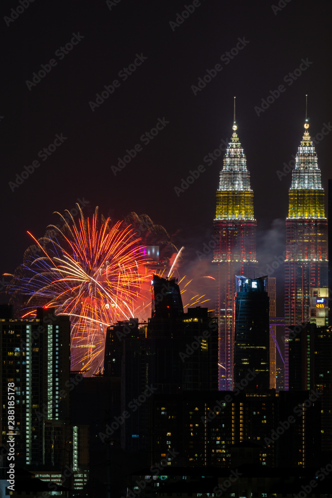 Fototapeta premium The Kuala Lumpur skyline glittered with a kaleidoscope of colours and spectacular lights and sound to mark the nation’s 62 years of independence of Malaysia.