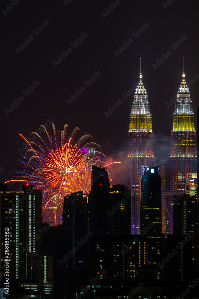 Fototapeta premium The Kuala Lumpur skyline glittered with a kaleidoscope of colours and spectacular lights and sound to mark the nation’s 62 years of independence of Malaysia.