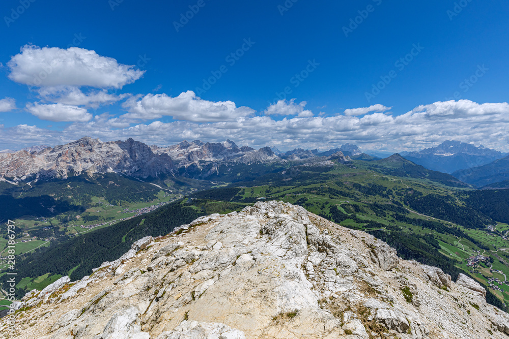 Stunning panoramic view of Italian Dolomites from the top of the  Sassongher  mountain. Italian Alps, Colfosco - Alta Badia.