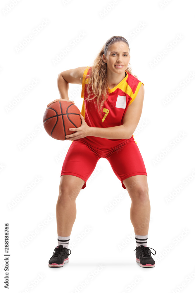 Professional female basketball player in a red jersey Professional female basketball player in a red jersey