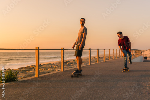 Skaters training near the sea