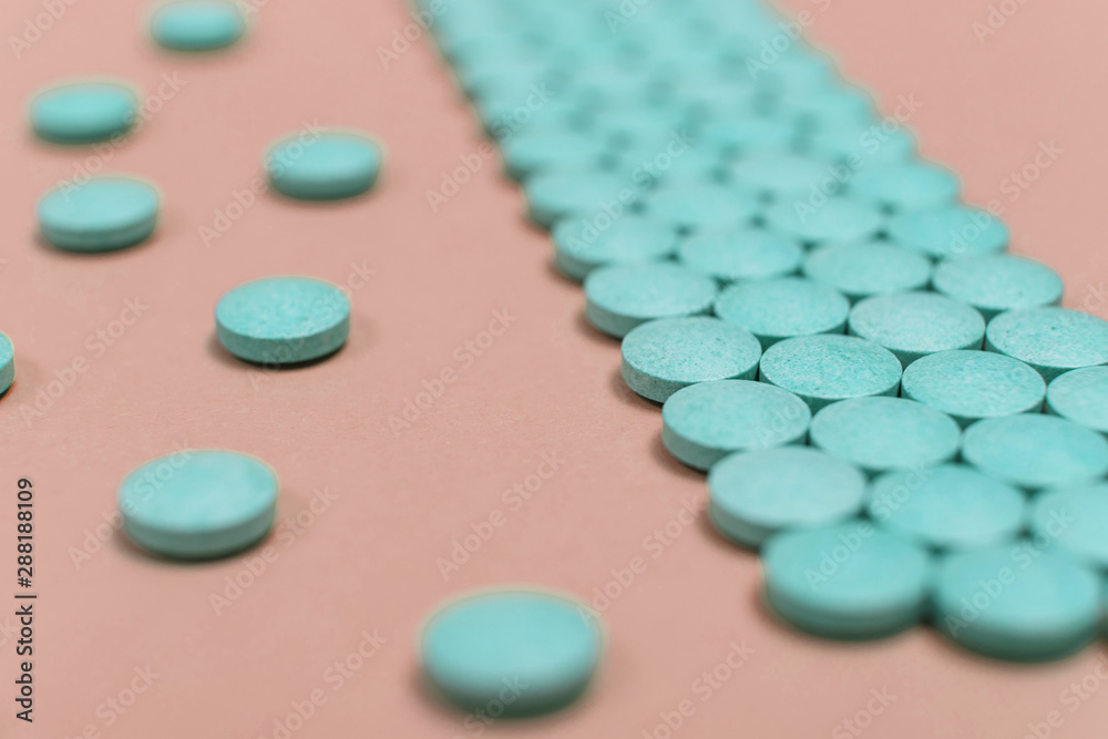 Many brown pills on a purple background Many brown pills on a purple background