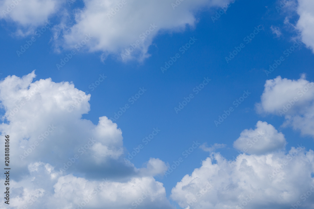 blue sky with white clouds, center place for text blue sky with white clouds, center place for text