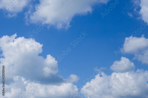 blue sky with white clouds, center place for text