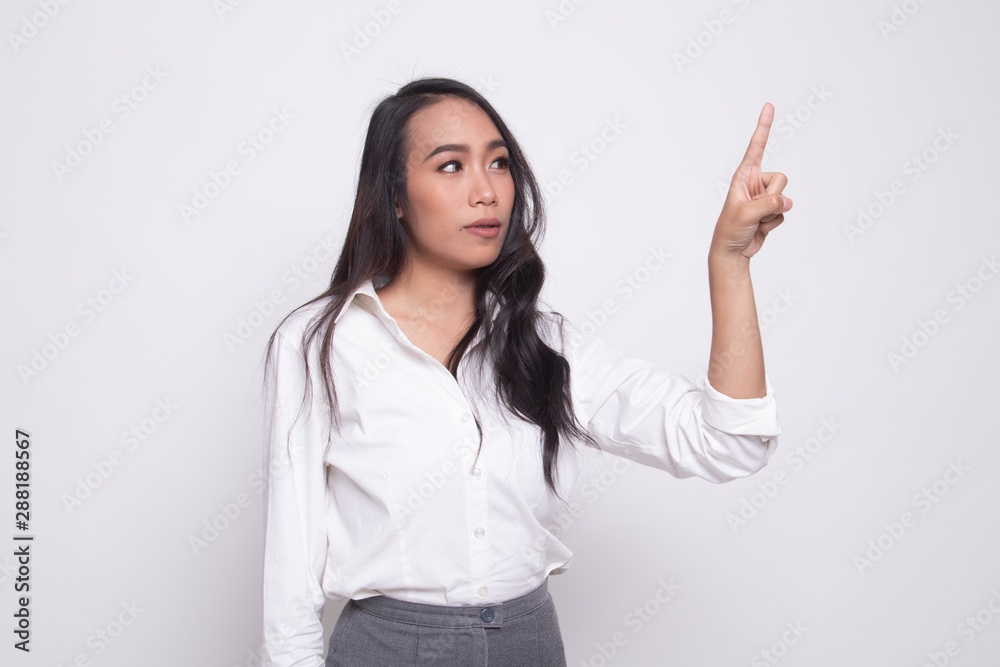 Asian woman touching the screen with finger. Asian woman touching the screen with finger.
