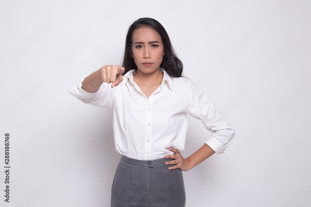 Young Asian woman angry and point to camera. Young Asian woman angry and point to camera.