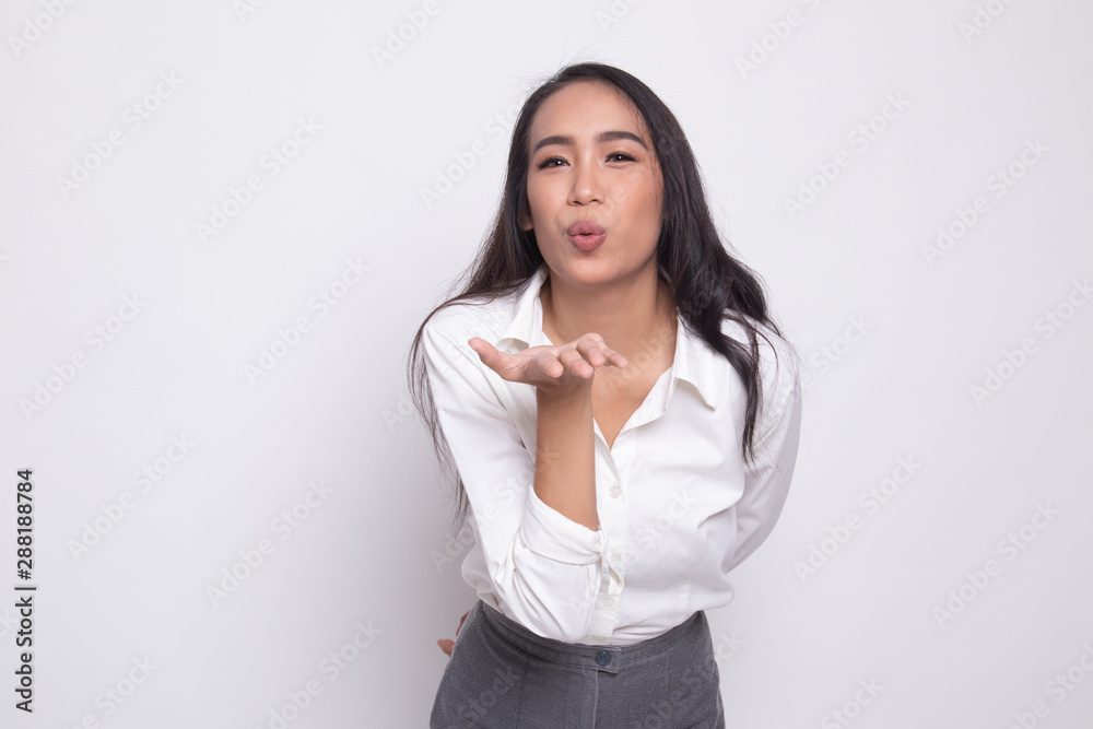 Beautiful young Asian woman blow a kiss. Beautiful young Asian woman blow a kiss.