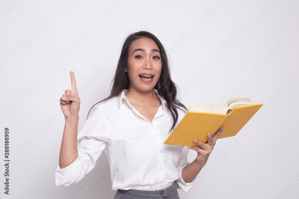 Young Asian woman with a book have an idea. Young Asian woman with a book have an idea.