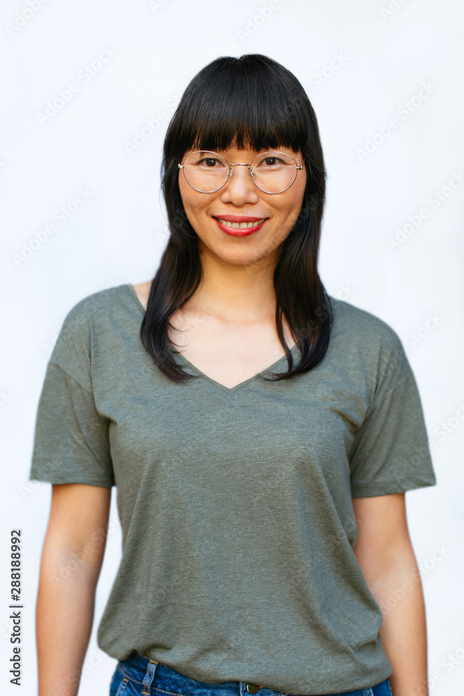 Portrait of a Chinese woman over white background. Portrait of a Chinese woman over white background.