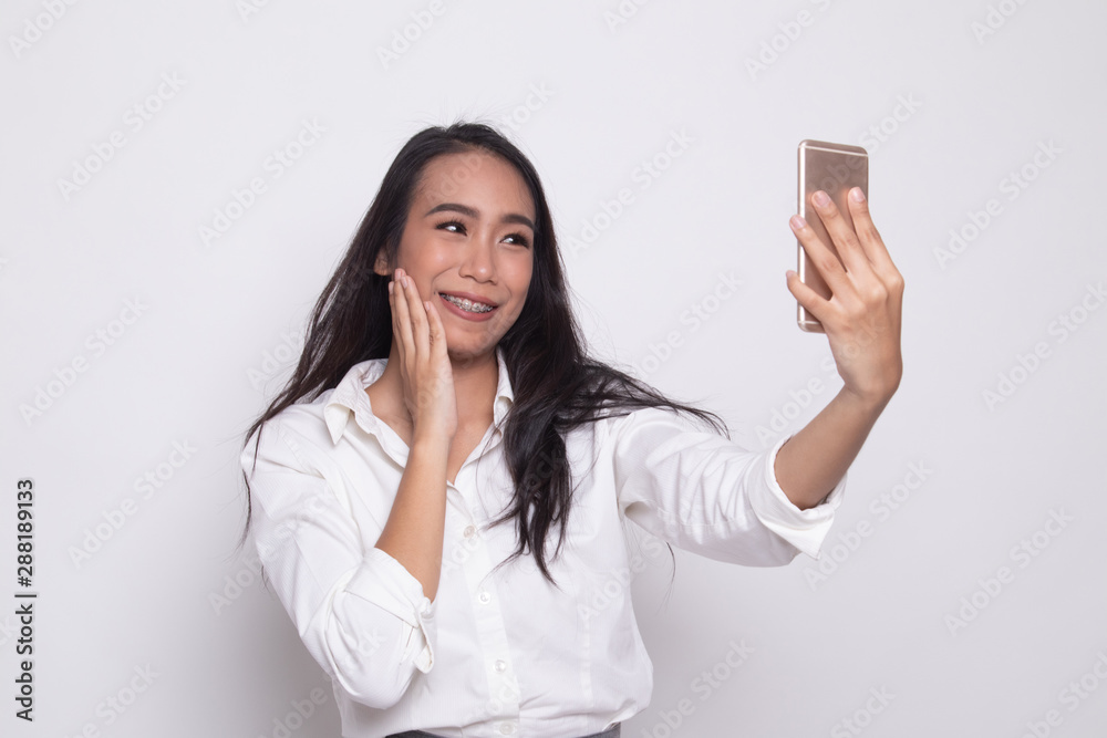 Young Asian woman selfie with mobile phone. Young Asian woman selfie with mobile phone.
