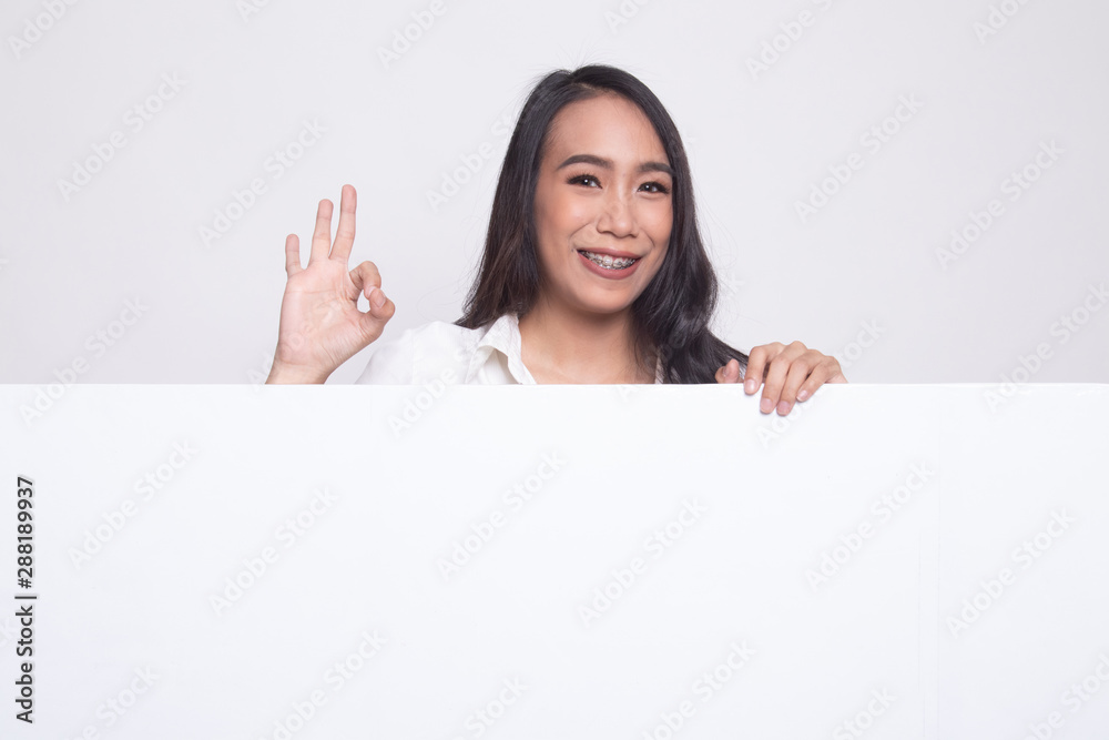 Young Asian woman show OK with blank sign. Young Asian woman show OK with blank sign.