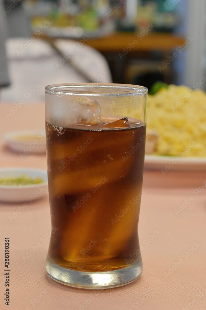 Cola in glass with ice in the restaurant. Cola in glass with ice in the restaurant.