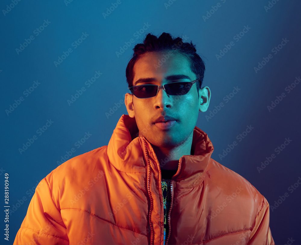 Stunning portrait man under colourful lights Stunning portrait man under colourful lights