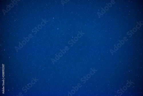 Night dark blue sky with bright stars as space background