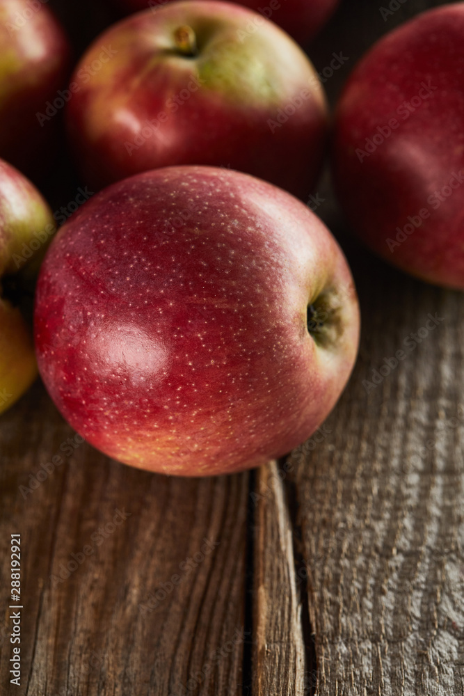 sweet ripe apples on brown wooden surface sweet ripe apples on brown wooden surface