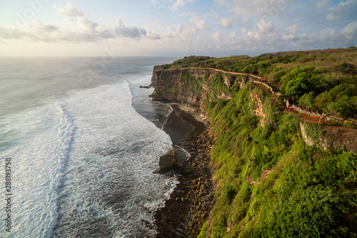 Uluwatu Temple On A Cliff at sunset, Bali. photo